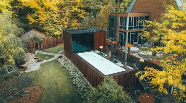 The new pavilion adds capacity to the spa, architecture, autumn, backyard, building, cottage, courtyard, design, estate, garden, home, house, landscape, landscaping, leaf, mountain, nature, plant, property, real estate, residential area, roof, sky, tree, woody plant, yard, yellow, brown
