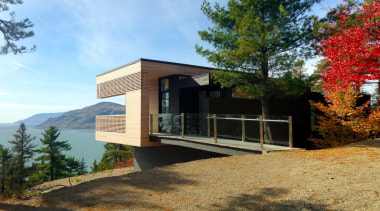 Sited high above Canada's St Lawrence river, this architecture, building, cottage, design, facade, home, house, landscape, property, real estate, room, tree