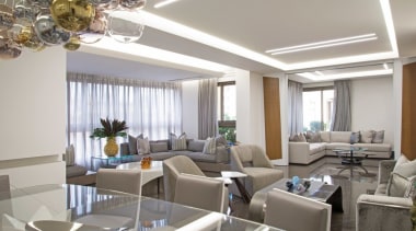 The living area is a big open space, apartment, building, ceiling, dining room, floor, furniture, home, house, interior design, living room, property, real estate, restaurant, room, suite, table, gray