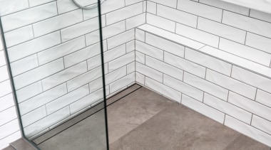 A tile insert channel drain contributes to a 