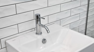 The tiles, basin and tapware all exhude a 