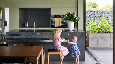 A lowered stainless-steel workspace cantilevers off the monolithic 