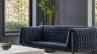 While the interior is strikingly modern, traditional elements gray, black