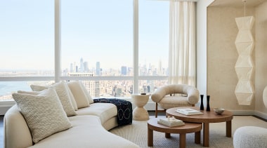 The curved sofa contours around coffee tables custom 