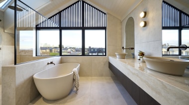 A high ceiling, expansive windows, and a skylight 