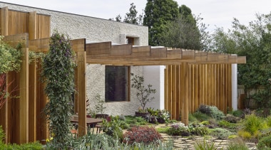 The pergola at the side of the home. 