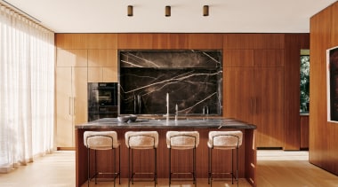 The wood and stone kitchen in its spacious 