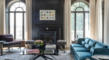 The living room features custom contemporary furnishings in 