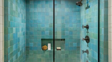 Green zellige bath tiles make quite a textural 