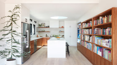 In the new kitchen, a custom bookshelf and 