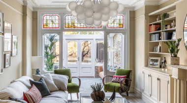 In the living room, a new pillowy sofa 