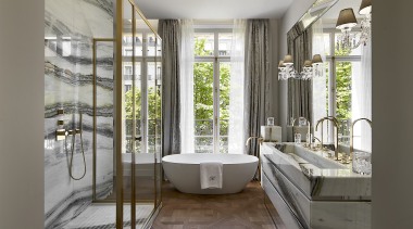This bathroom needs non-slip floors, dripping in sheer gray