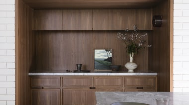 Custom kitchen/storage joinery has a furniture-like appeal. 