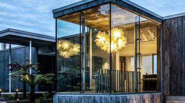 The industrial glass box staircase was warmed up 