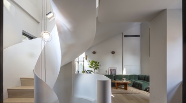 The sculptural steel staircase at ground floor. 