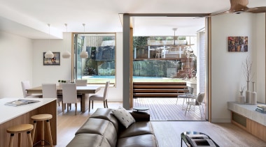 Kitchen, dining and living co-exist harmoniously in this 