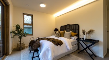 The master bedroom opens to the deck while 