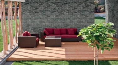Brick One will never require sealing and is backyard, couch, floor, flooring, furniture, grass, hardwood, outdoor furniture, outdoor structure, patio, table, wall, wood, gray