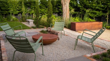Al fresco confab/dining area with pétanque piste behind. 