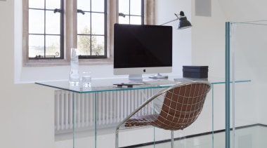 The glass-floored, mezzanine-level study enjoys spectacular views of 