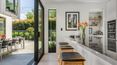 The kitchen opens up to the home's central 