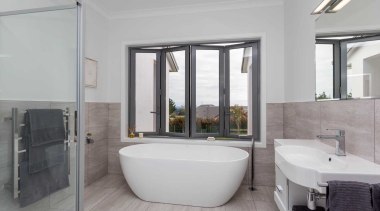 Contemporary Bathroom With Freestanding Tub And Tiled Surfaces architecture, bathroom, estate, floor, interior design, property, real estate, room, window, gray