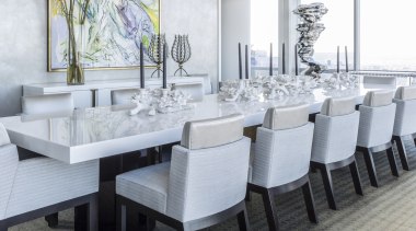 In the dining room, the expansive lacquered table 