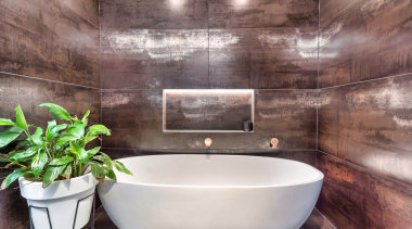The bath inhabits its own dedicated space. - 