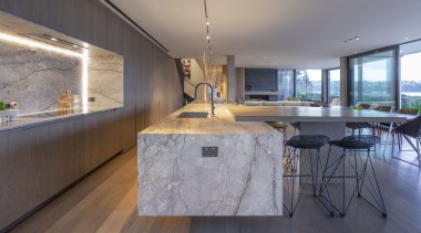 The chunky stone island is cantilevered to sense-of-lightness 