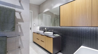 Push-to-open mirror-fronted cabinets optimise storage and light play. 