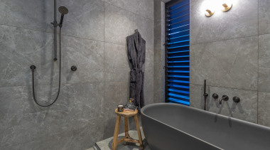 A wet room area behind a glass screen 