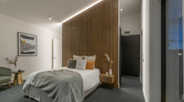 Bedroom with feature headboard / space divider. 