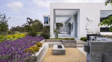 The entertaining area’s playful elements include a fire-pit 