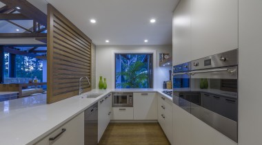 Wood floors and metal appliances both work well architecture, building, cabinetry, ceiling, countertop, design, floor, flooring, furniture, glass, home, house, interior design, kitchen, light fixture, lighting, material property, property, real estate, room, gray
