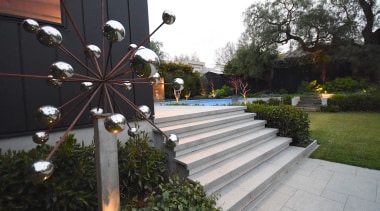 A garden sculpture next to the new pool 