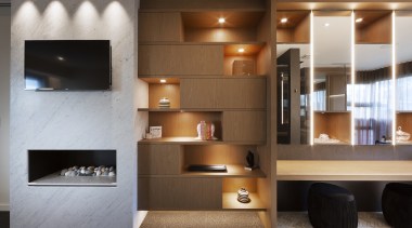 A change in flooring further delineates the master 