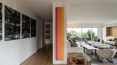 A wall separates living from entry and bedroom 