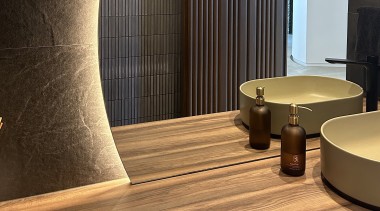 Tile texture is also accentuated via concealed lighting, 