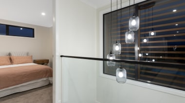 A double height void features outside bedroom 2 