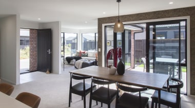 Natural light floods into the home's expansive open-plan 