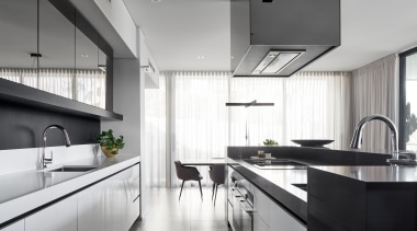 The minimalist kitchen features strong, simple forms. 