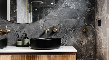 Stone-look tilework provides a complementary backdrop to the 