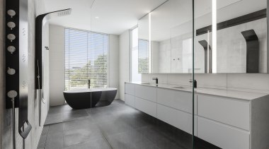 Pared back and sculptural, this bathroom boasts several 