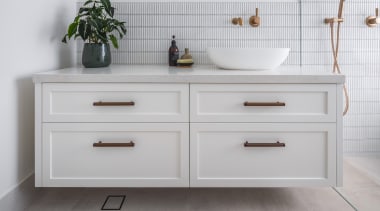 Cantilevering the vanity also adds to the bathroom's 