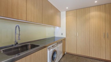 Laundry - cabinetry | countertop | kitchen | cabinetry, countertop, kitchen, laundry, laundry room, property, real estate, room, wood, gray, brown, orange