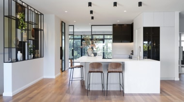 The kitchen has a contemporary aesthetic reflected by 