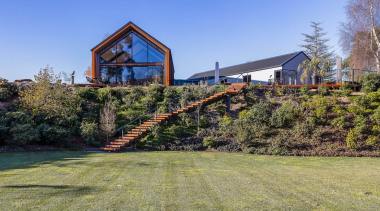 From the deck, timber steps lead down a 