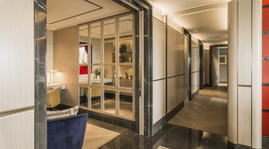 A study adjoins this formal living space separated 