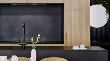 Ventilation grills are built into the upper cabinetry 