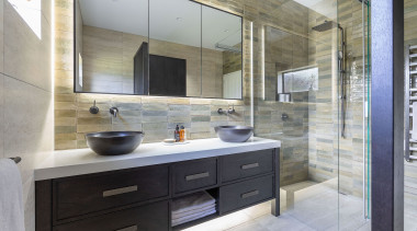 The timber vanity is substantial and masculine while 